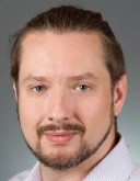 Headshot of Damon Hyde, an alumni of the localization lab. 