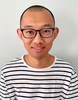 Headshot of Xiyu Ma, a man with glasses and a buzz cut wears a black and white striped shirt.