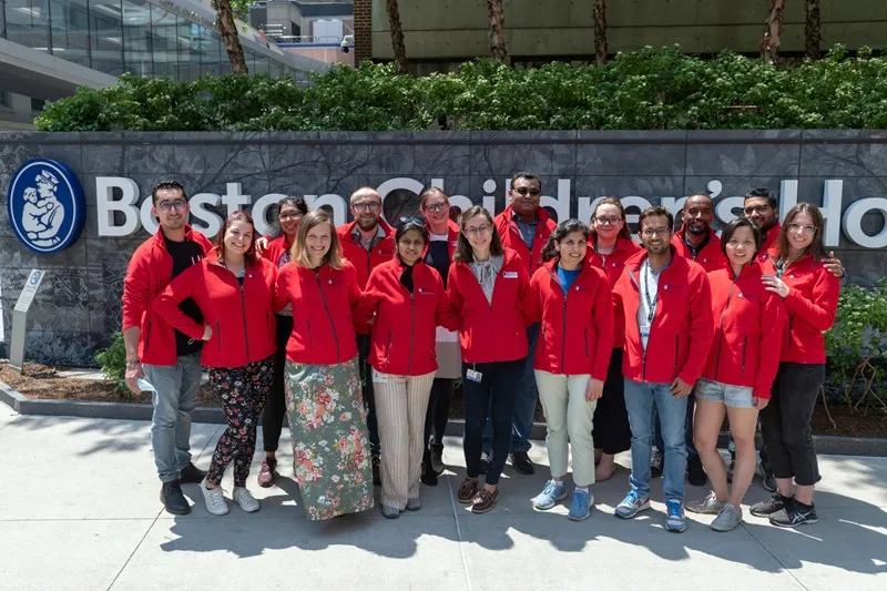 Sixteen men and women outside of Boston Children's Hospital