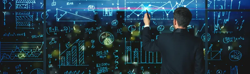 Man standing infront of projected computer screen