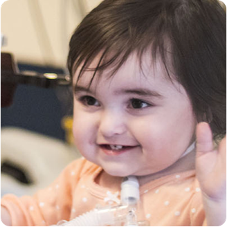 Baby with feeding tube in neck