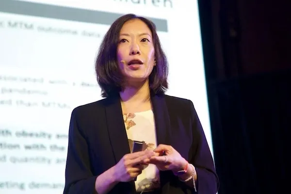 Dr. Wu speaking on stage