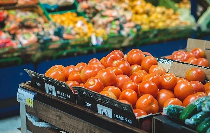 box of tomatoes in a grocery store