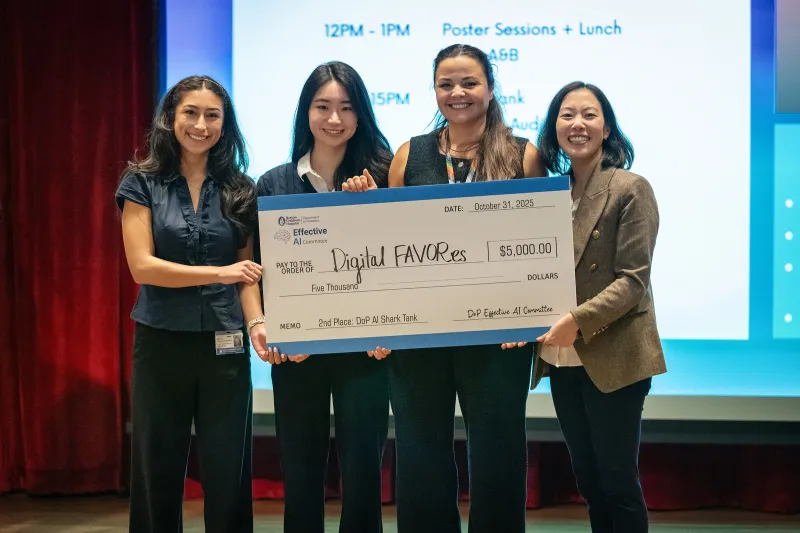 Wunderfull Lab team on stage receiving second place at the AI Shark Tank competition during the 2025 Boston Children’s Hospital AI Symposium