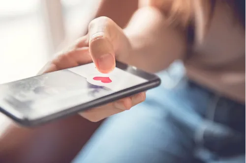 A person holding a phone in their hand