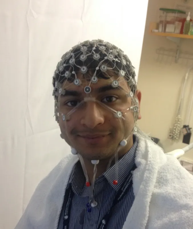 Archis wearing an EEG hat.