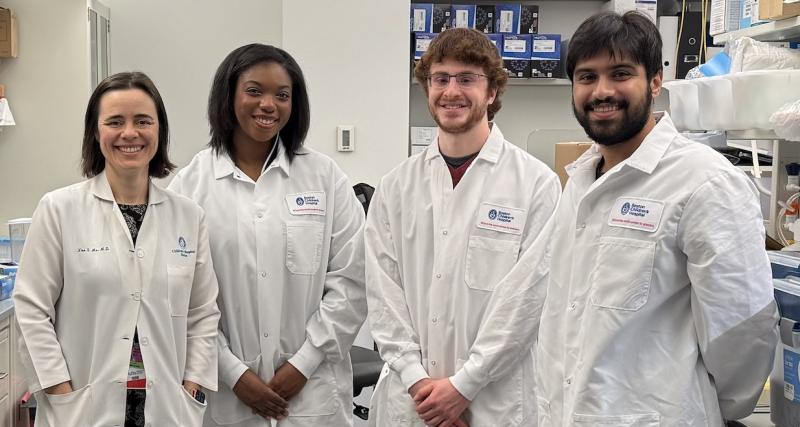 Two women and two men in a lab