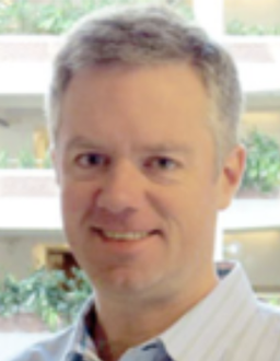 Headshot of Geoff Burns, a man with short gray hair.