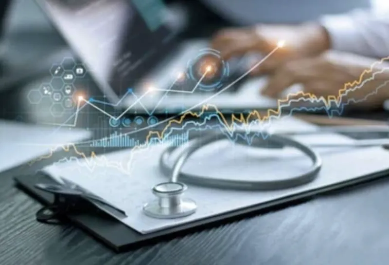 A clipboard  laying on a desk with a stethoscope on top of it.