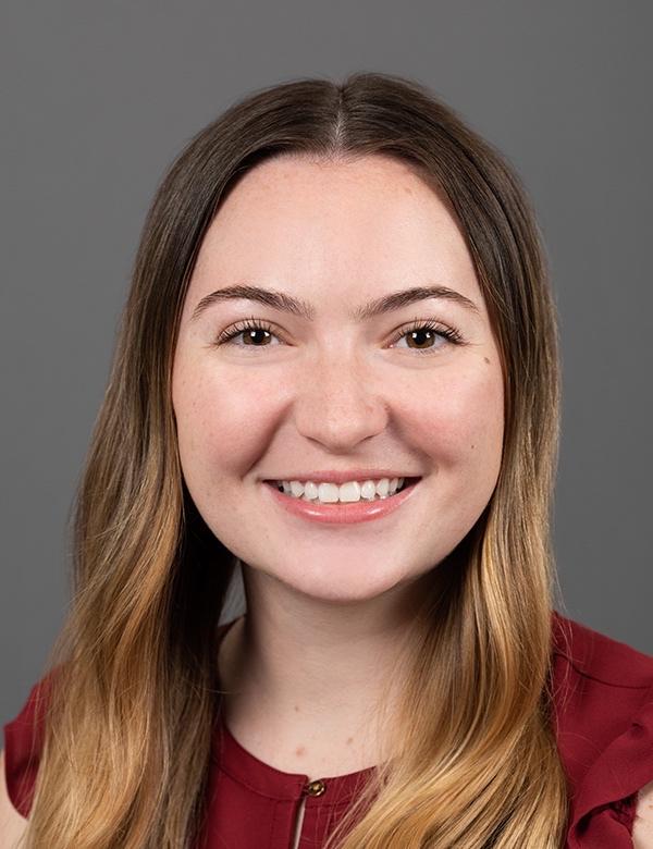 Headshot of of Rachel D'Anna, a woman with dark blond hair smiles at the camera.