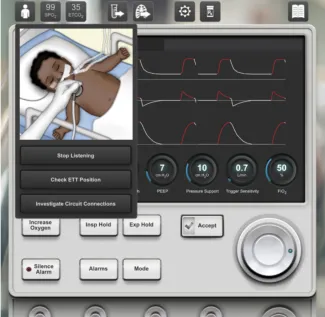 A baby is shown in a hospital bed in front of an image of screen that is monitoring him.