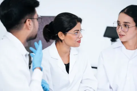 Three doctors talking